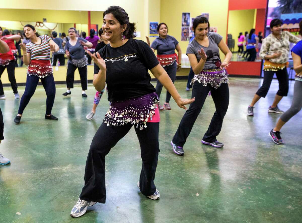 Ruchika Dias leads a dance fitness class at Bollywood Shake on Tuesday, March 24, 2015, in Houston. The class is based on Bollywood music and culture from India. ( Brett Coomer / Houston Chronicle )