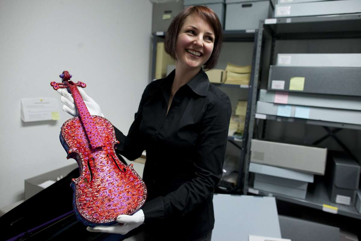 Michelle Kaufman, collections manager for the Marin History Museum holds a painted violin that was painted and donated by Grace Slick on March 30, 2011 in Novato, Calif. Photograph by David Paul Morris/Special to the Chronicle