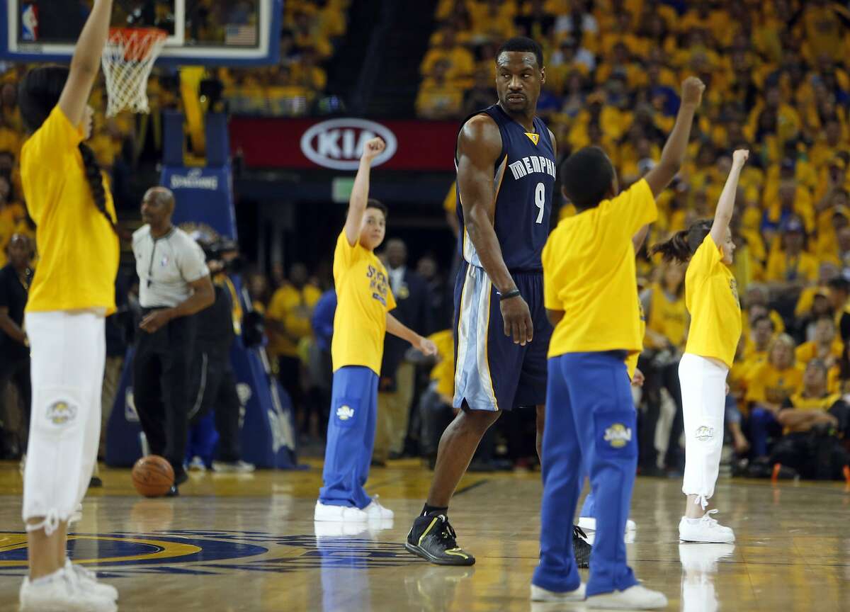 Memphis Grizzlies' Tony Allen walks through a Golden State Warriors' timeout performance during Game 1 of NBA Playoffs' Western Conference Semifinals in Oakland, Calif., on Sunday, May 3, 2015.