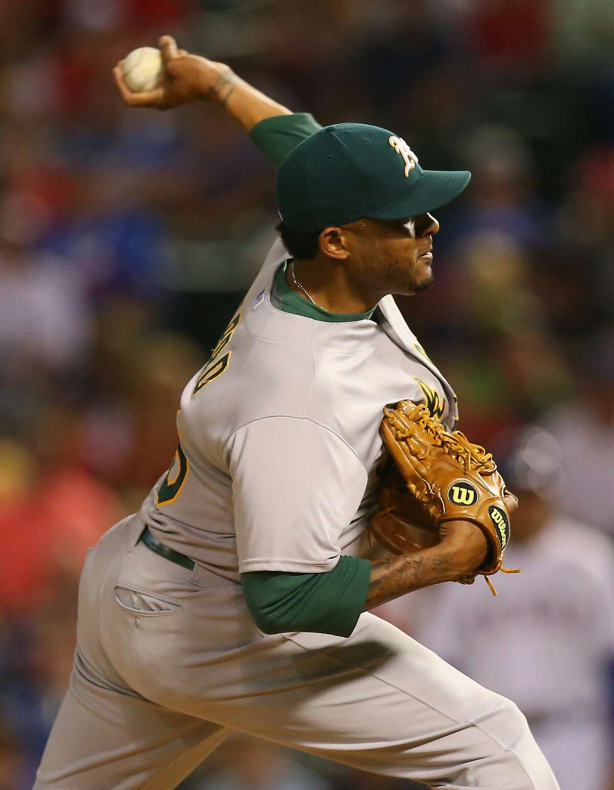 ARLINGTON, TX - MAY 01: Fernando Abad #56 of the Oakland Athletics throws against the Texas Rangers in the seventh inning at Globe Life Park in Arlington on May 1, 2015 in Arlington, Texas. (Photo by Ronald Martinez/Getty Images)