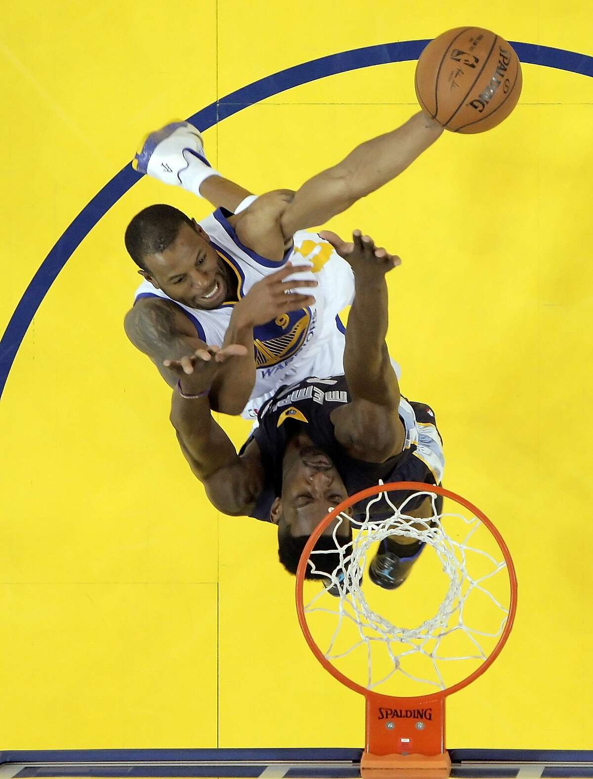 Andre Iguodala (9) puts in a shot defended by Jeff Green (32) during the first half. The Golden State Warriors played the Memphis Grizzlies at Oracle Arena in Oakland, Calif., in Game 1 of the Western Conference Semifinals on Sunday, May 3, 2015.