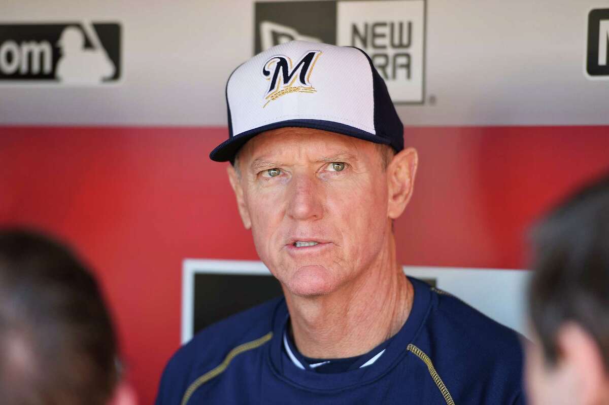 CINCINNATI, OH - APRIL 28: Manager Ron Roenicke #10 of the Milwaukee Brewers speaks to the media in the dugout before their game against the Cincinnati Reds at Great American Ball Park on April 28, 2015 in Cincinnati, Ohio. (Photo by Jamie Sabau/Getty Images)