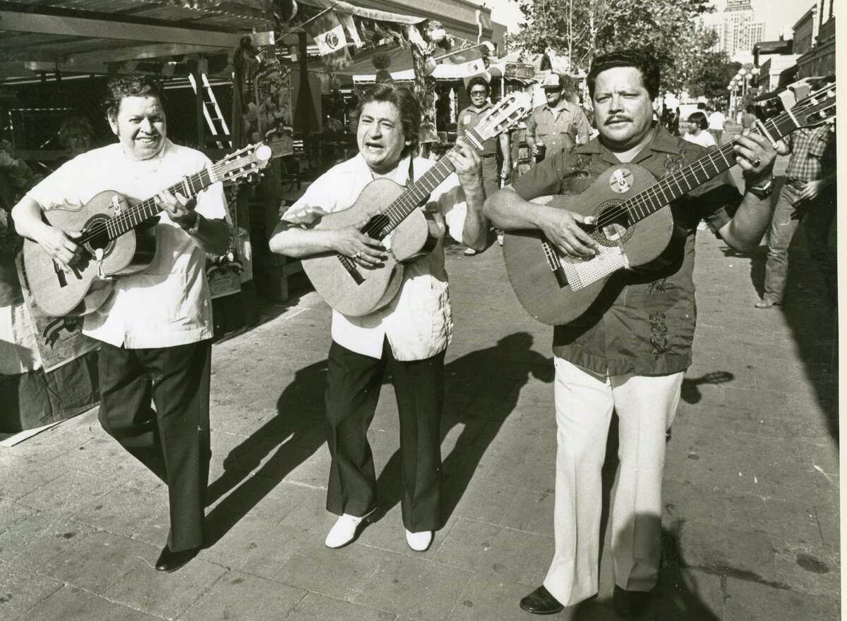 Romelio Alcoser, Jose Chato and Manuel Pena — Los Comadres — entertain El Mercado in 1983. 