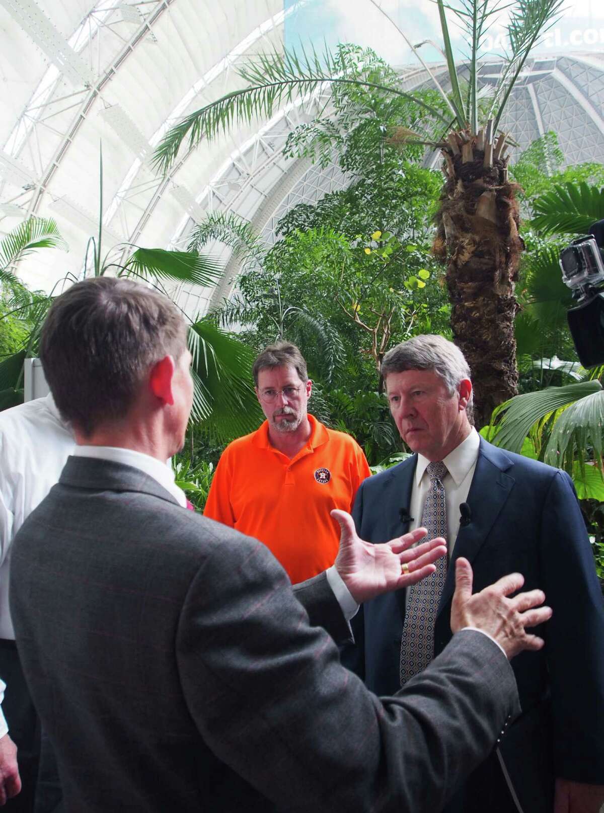 Philipp Amstutz, left,Tropical Islands director of operations, talks with Judge Ed Emmett, Harris County’s highest elected official, right, and Harris County director of communications Joe Stinebaker, center, in Brand, near Berlin, Germany, Monday, May 4, 2015, at the Tropical Islands, where ambitious entrepreneurs planned to revive Germany's zeppelin industry. A delegation from Texas toured the facility to see if lessons learned by the Germans can be applied to converting the Houston Astrodome _ the world's first multi-purposed domed stadium, which hasn't been home to a sports team since 1999 and has been closed to all events since 2009. (AP Photo/David Rising)