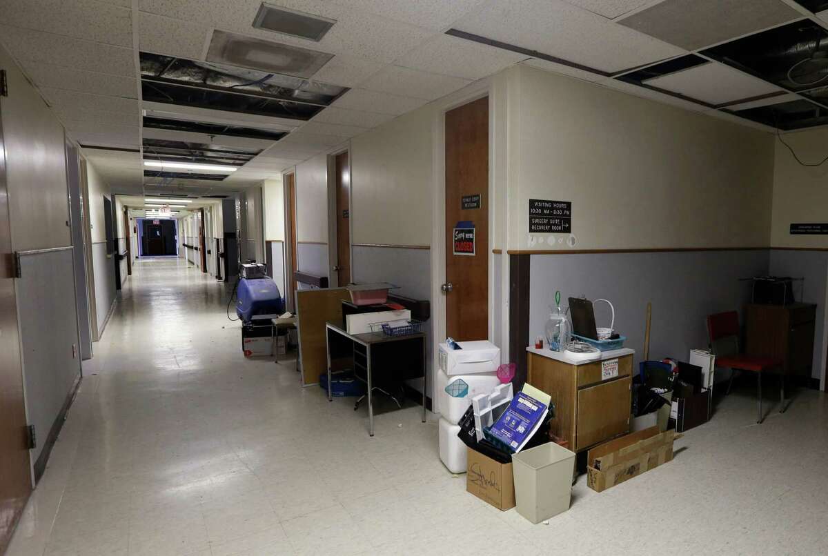 Remaining equipment and supplies are stacked for sale in a hallway at Sac-Osage Hospital in Osceola, Mo. Sac-Osage Hospital is being sold piece-by-piece. Ceiling tiles are going for 25 cents, the room doors for an average of less than $4 each, and the patient beds for $250 apiece.