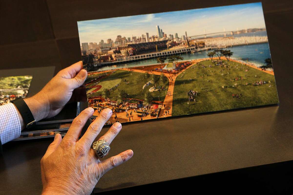 Giants vice president Jack Bair points to an artist's rendition of the proposed development for Lot A, Monday, May 4, 2015, in San Francisco, Calif.