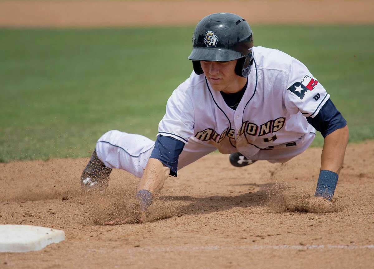 The Missions’ Trea Turner dives back to first base to avoid being tagged out during a Texas League game against the Midland RockHounds on May 4, 2015, at Wolff Stadium in San Antonio. Midland won 4-3.