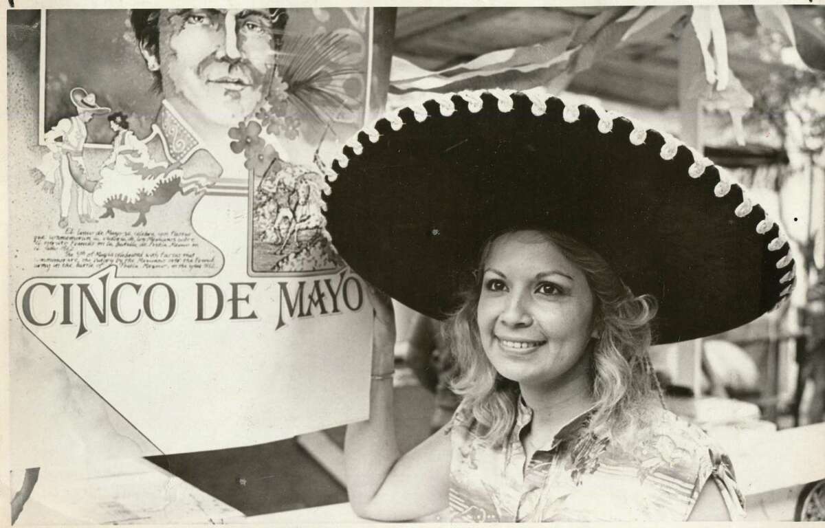 Bette Linda Idar waits for customers by her sausage booth in Market Square for Cinco de Mayo 1981.