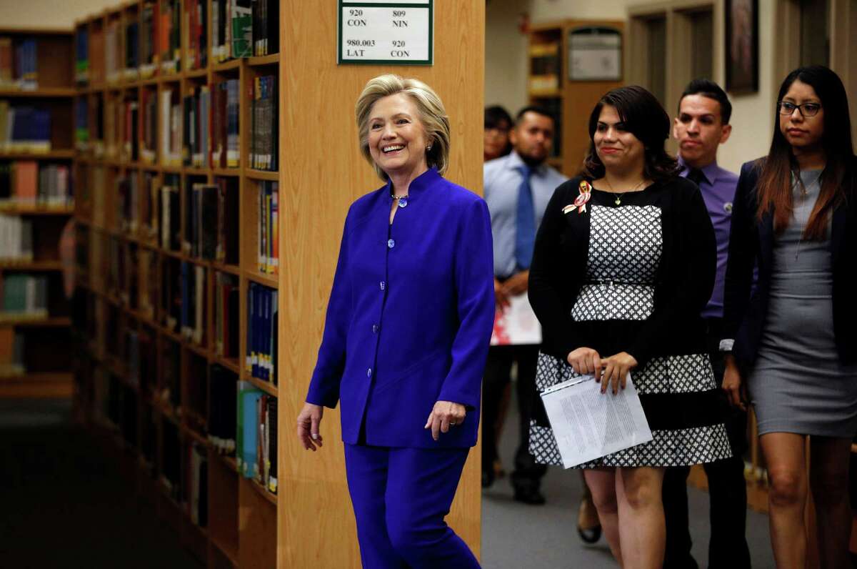 Democratic presidential candidate Hillary Rodham Clinton walks into an event at Rancho High School Tuesday, May 5, 2015, in Las Vegas. (AP Photo/John Locher)