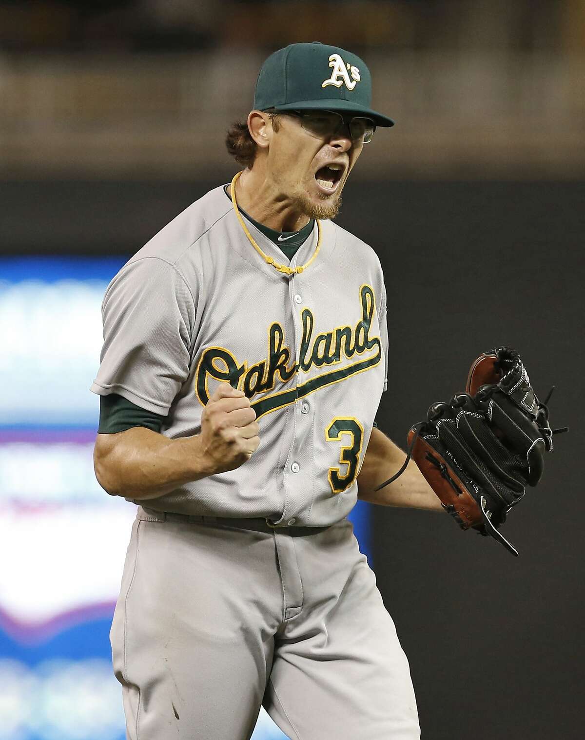 Oakland Athletics relief pitcher Tyler Clippard celebrates after striking out Minnesota Twins' Kennys Vargas to end the baseball game, Tuesday, May 5, 2015, in Minneapolis. The Athletics won 2-1, with Clippard picking up the save. (AP Photo/Jim Mone)