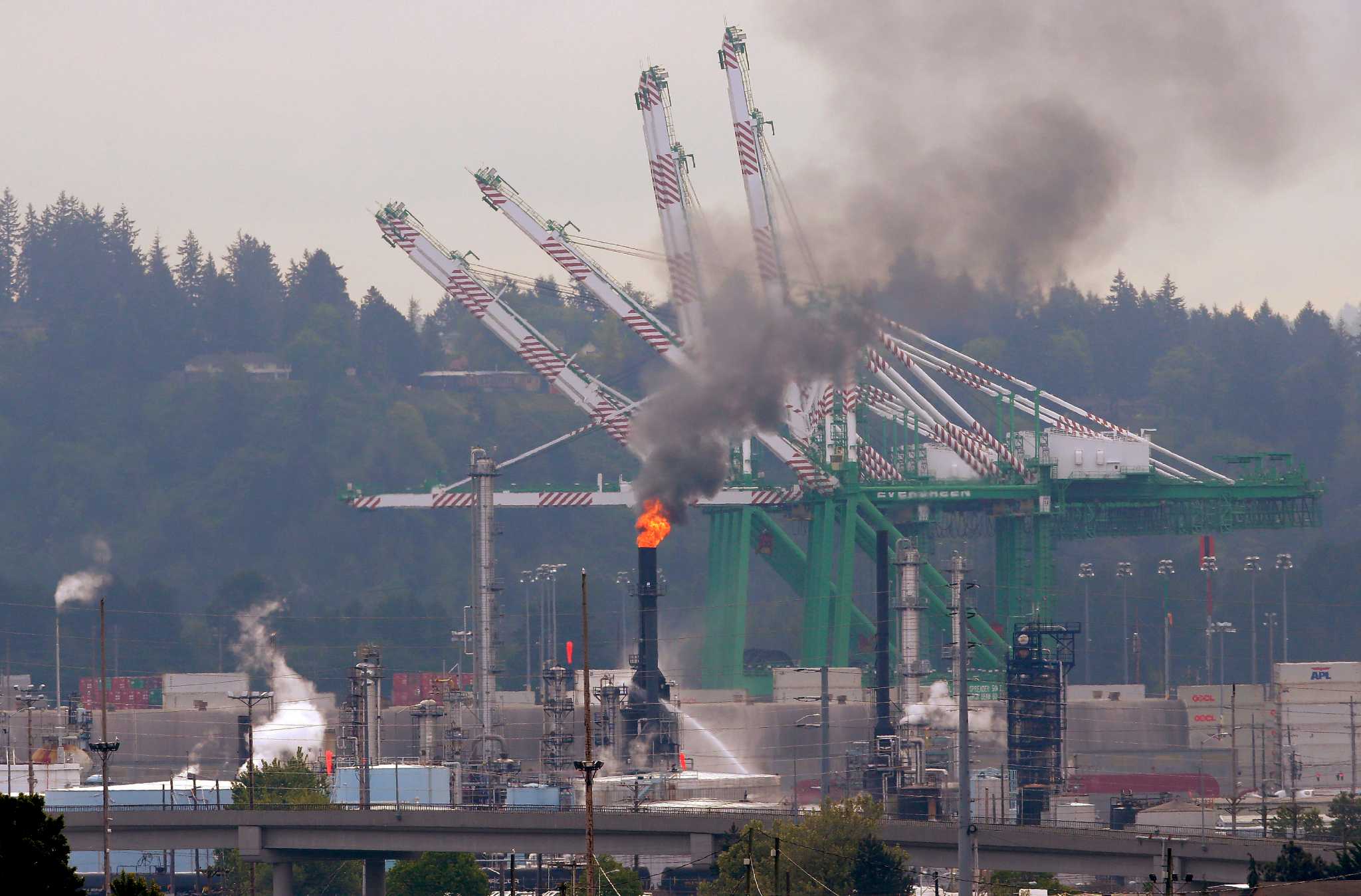 refinery fire sends up huge column of smoke