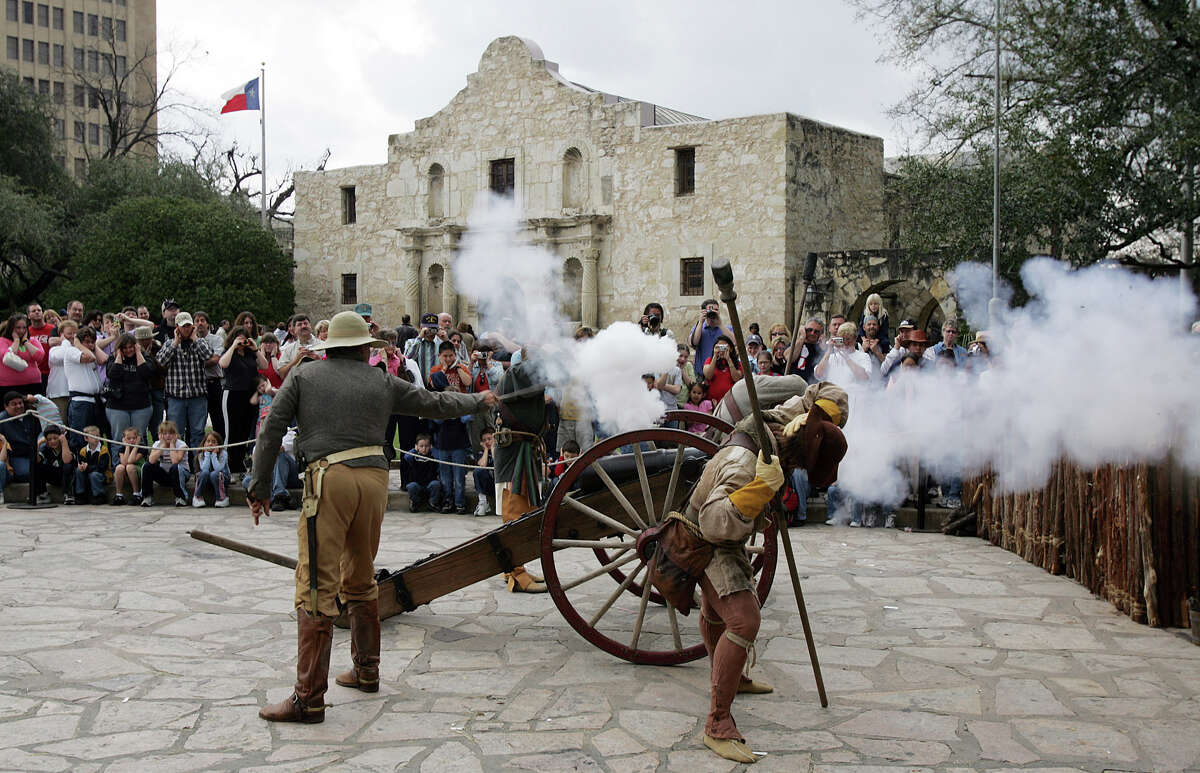 Members of the San Antonio Living History Association demonstrate the firing of a "four-pound" cannon in front of the Alamo as part of "Remembering The Alamo" weekend on Saturday, Mar. 5, 2005. The non-profit organization presented re-enactments of the battle at the Alamo to audiences to provide a understanding of the people who fought and died at the mission in March of 1836. (Kin Man Huistaff)