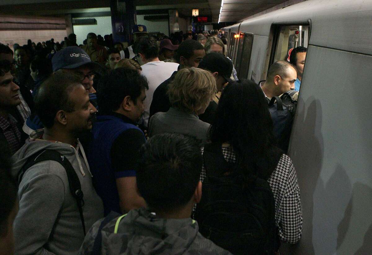 Hundreds try to cram the Pittsburg / Bay Point train from Montgomery BART station, Wednesday, May 6, 2015, in San Francisco, Calif. Trains were delayed all day because of a 10-inch section of broken rail between the Civic Center and 16th Street Mission stations.
