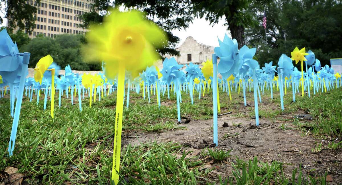 May Mental Health Awareness Month, 3,000 pinwheels were placed on the battleground of The Alamo serving as symbols of hope for children suffering from mental illness, on Wednesday, May 6, 2015. The One in Five Minds campaign, sponsored by clarity Child Guidance Center, presented mental health specialists and public leaders, including Judge Luz Elena D. Chapa of the Fourth Court of Appeals, whose brother Michael suffers from mental illness. A yellow pinwheel spins in the breeze, representing one in five children who struggle with mental illness.