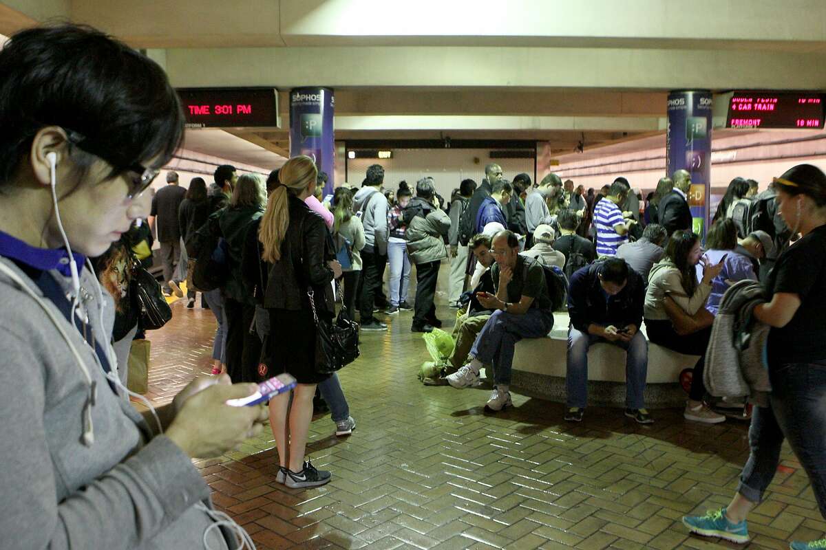 Hundreds of commuters wait to board trains at Montgomery BART station, Wednesday, May 6, 2015, in San Francisco, Calif. Trains were delayed all day because of a 10-inch section of broken rail between the Civic Center and 16th Street Mission stations.