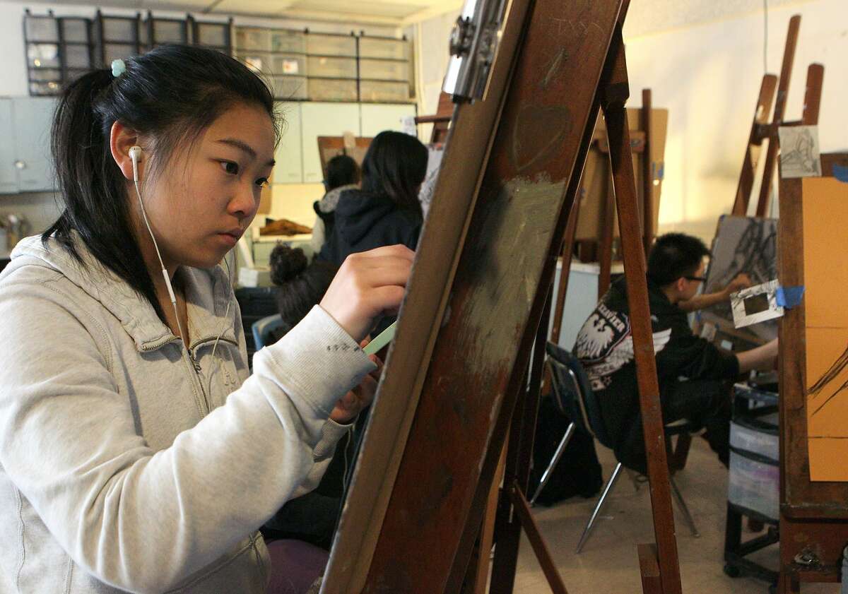 Sixteen-year-old Joy Lu draws during an intro to drawing class at the Ruth Asawa San Francisco School of the Arts, Wednesday, May 6, 2015, in San Francisco, Calif. The S.F. school board is considering changes to the school enrollment because there are too many out-of-towners and not enough diversity.