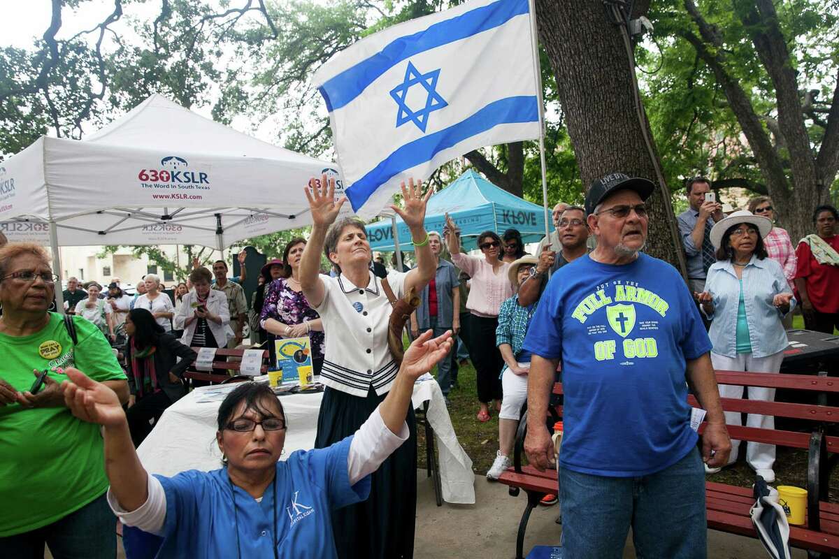 A crowd sings during a worship song during the National Day of Prayer Thursday May 7, 2015 on the steps of City Hall. This is the 64th annual prayer, and the 30th consecutive year that San Antonio has participated. The National Day of Prayer was created in 1952 by President Harry Truman and signed into law by both Houses of Congress. In 1988 President Ronald Reagan signed a resolution amending the law making the National Day of Prayer to always be on the first Thursday of May each year. Organized by the San Antonio National Day of Prayer planning committee, speakers included Mayor Ivy Taylor, San Antonio Chief of Police Anthony Trevino, and local pastors who prayed for the city, nation and family.