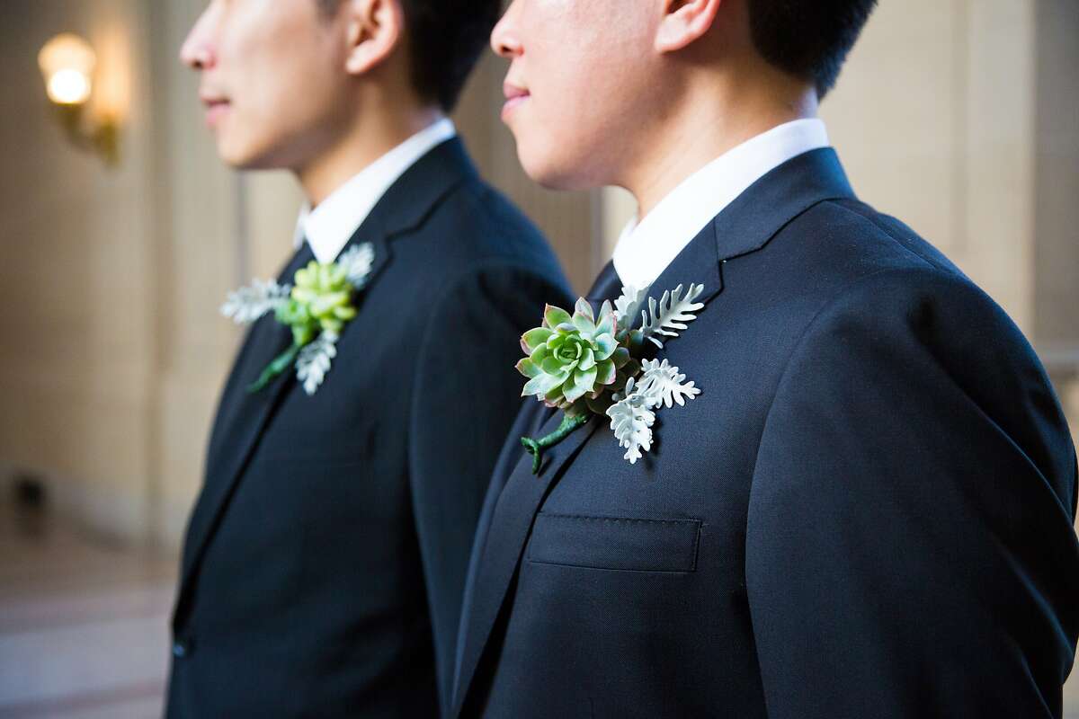 Alvin Wong and Long Le's friend made their drought-friendly boutonnieres from succulents in his backyard. They intend to reuse them at their reception dinner. City Hall, Friday May 1, 2015, in San Francisco, CA.