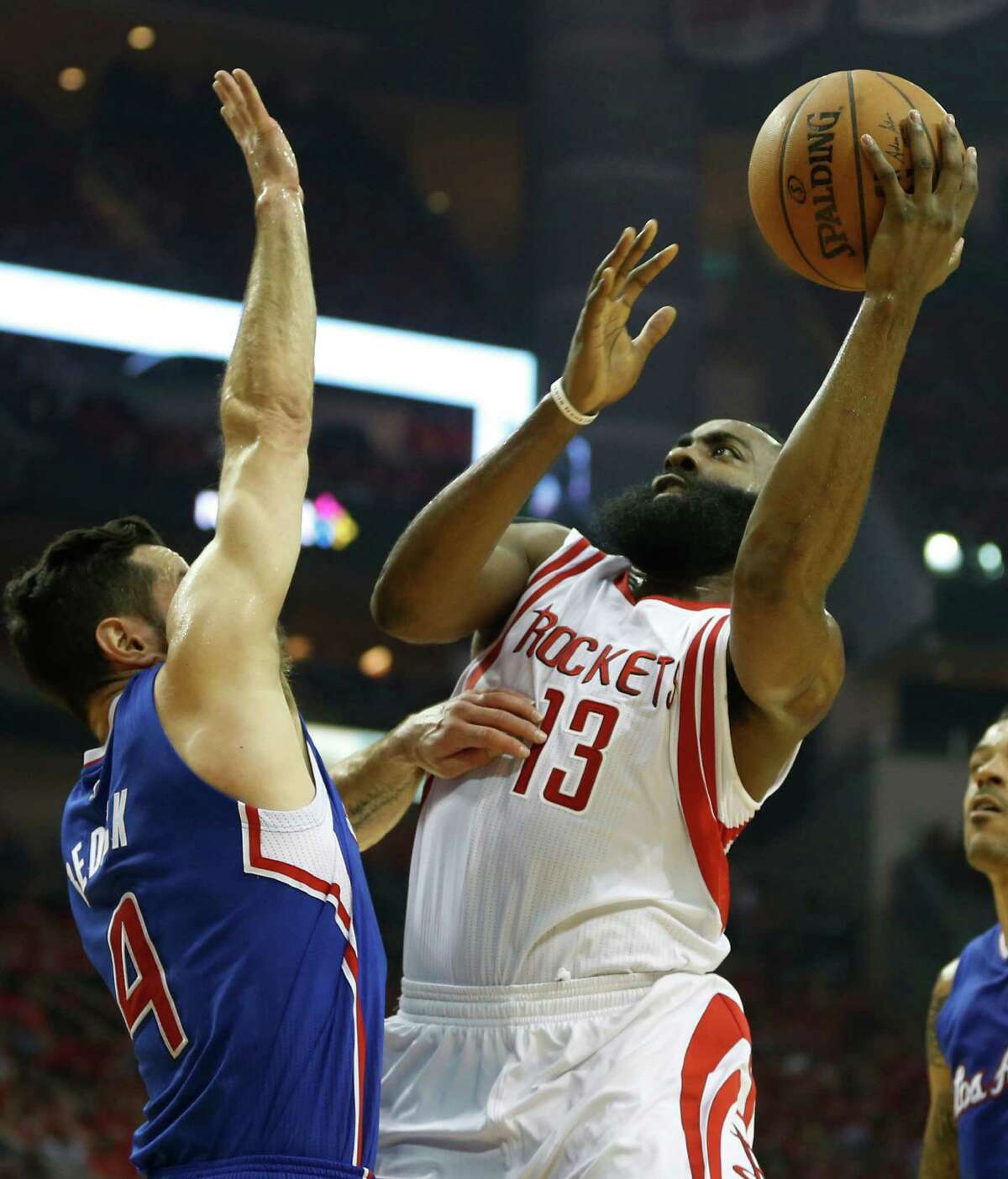 Rockets guard James Harden, right, says he started to find some holes in the defensive tactics of JJ Redick and his Clippers teammates during Game 2.