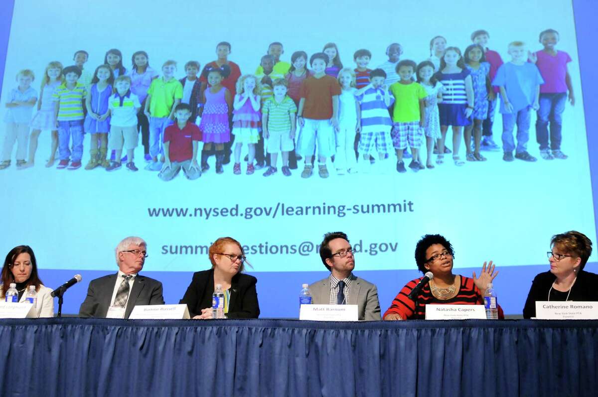 Natasha Capers, New York State Parent Teacher Assoc. panelist, second from right, speaks during a summit meeting on teacher evaluations and tests on Thursday, May 7, 2015, at the New York State Museum in Albany N.Y. (Cindy Schultz / Times Union)