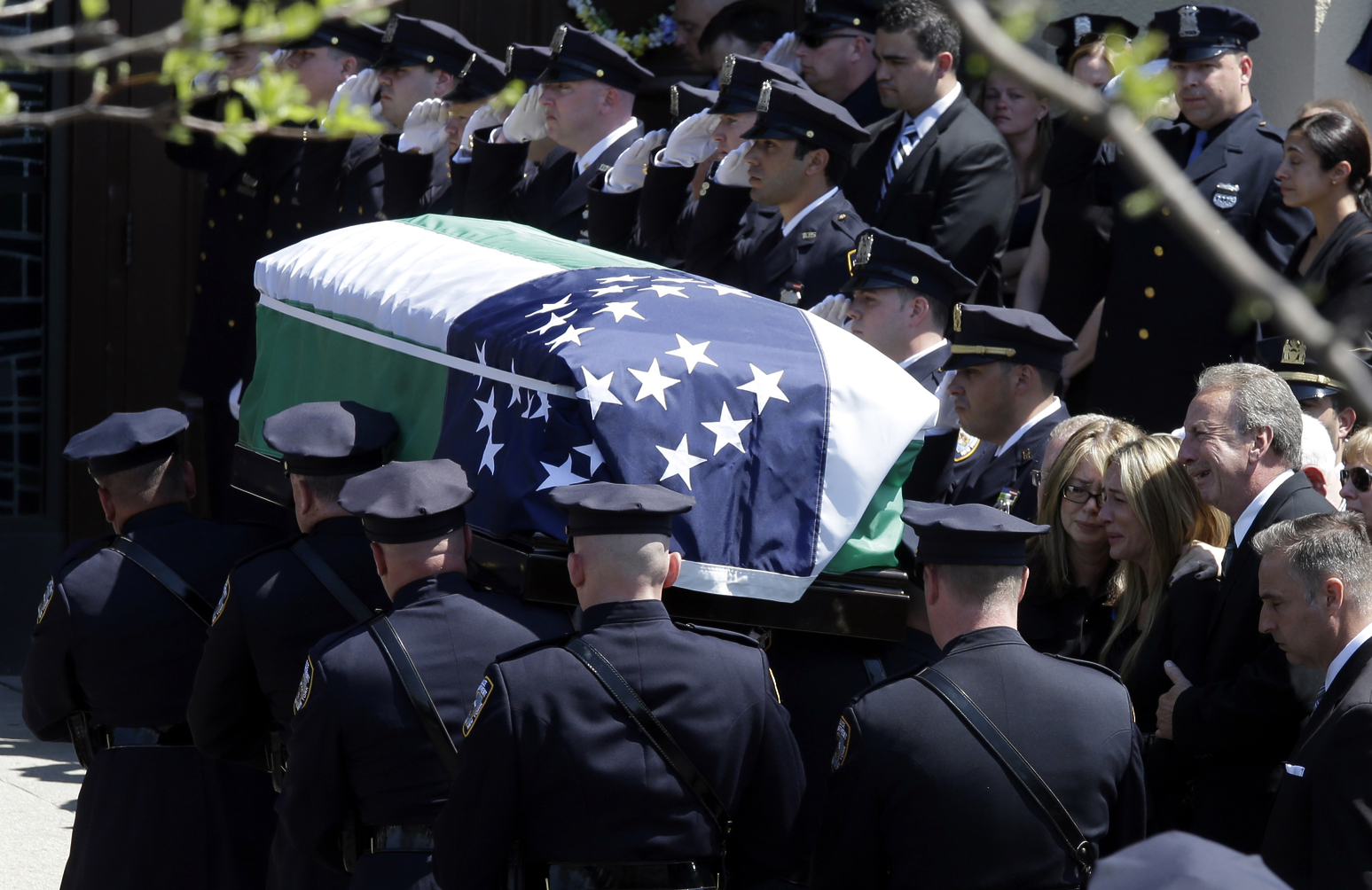 Thousands honor slain NYPD officer at funeral