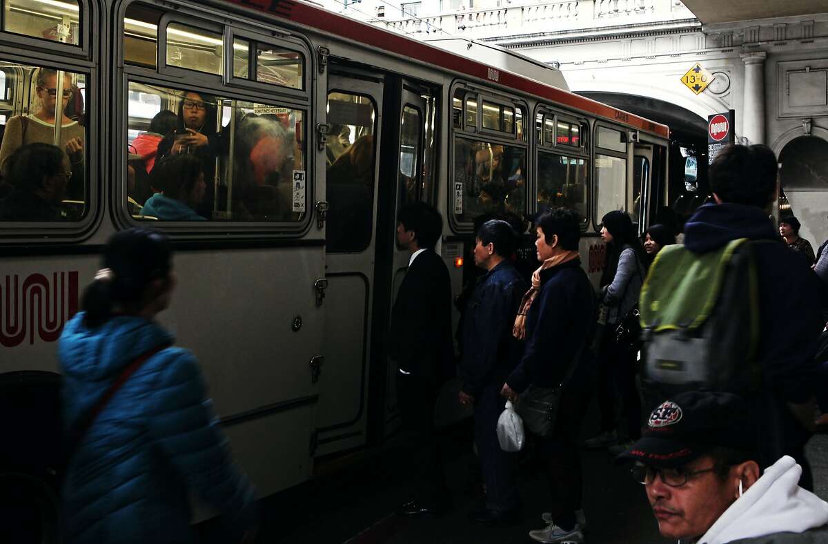 People crowd into the 30 - Stockston Muni bus before the stockton tunnel in San Francisco, Calif., Thursday May 7, 2015.