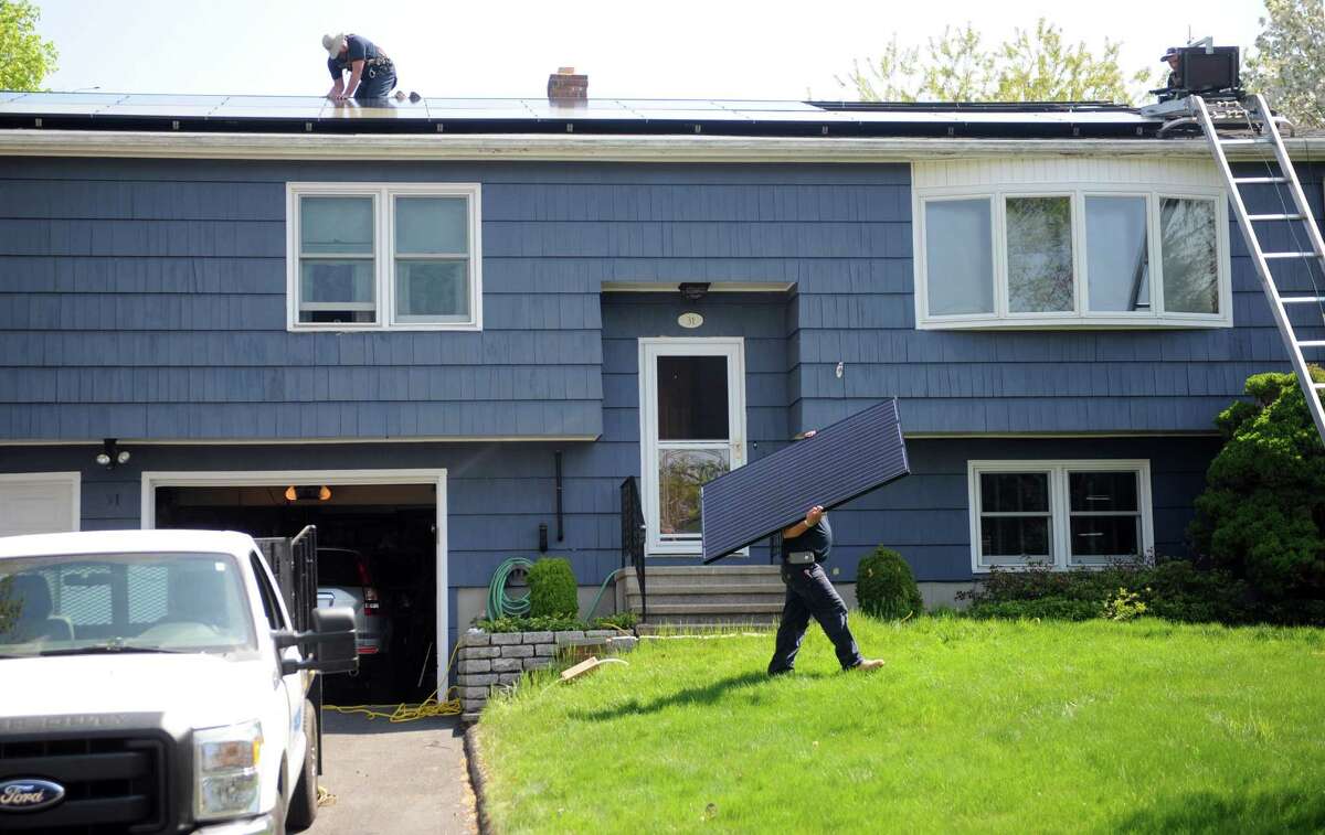 MOST Energy Efficient 9. ConnecticutTotal score: 72.75Home energy rank: 20Car energy rank: 11Source: WalletHubPictured: Martin Nicolaides, of Encon Solar, carries a solar panel during an installation at a home on Apple Hill Drive in Milford Friday, May 8, 2015.