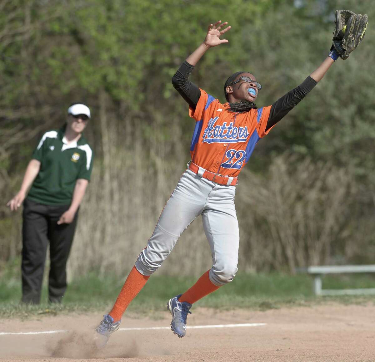 Danbury's Davonna Spruill (22) catches a pop up bunt during the girls high school softball game between Trinity Catholic and Danbury high schools on Friday, May 8, 2015, played at Danbury High School, in Danbury, Conn.