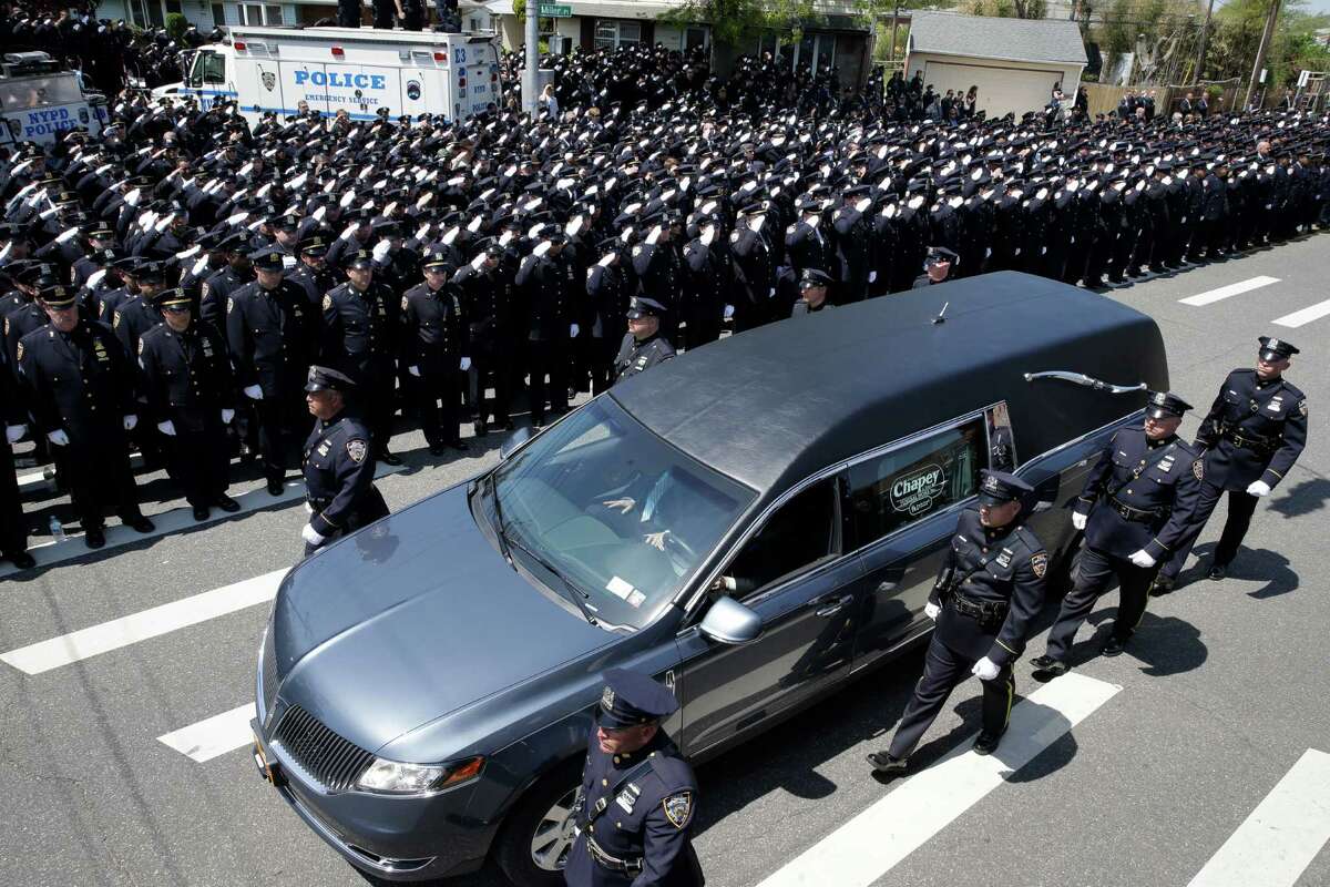 At New York officer's funeral, police reflect on tough time
