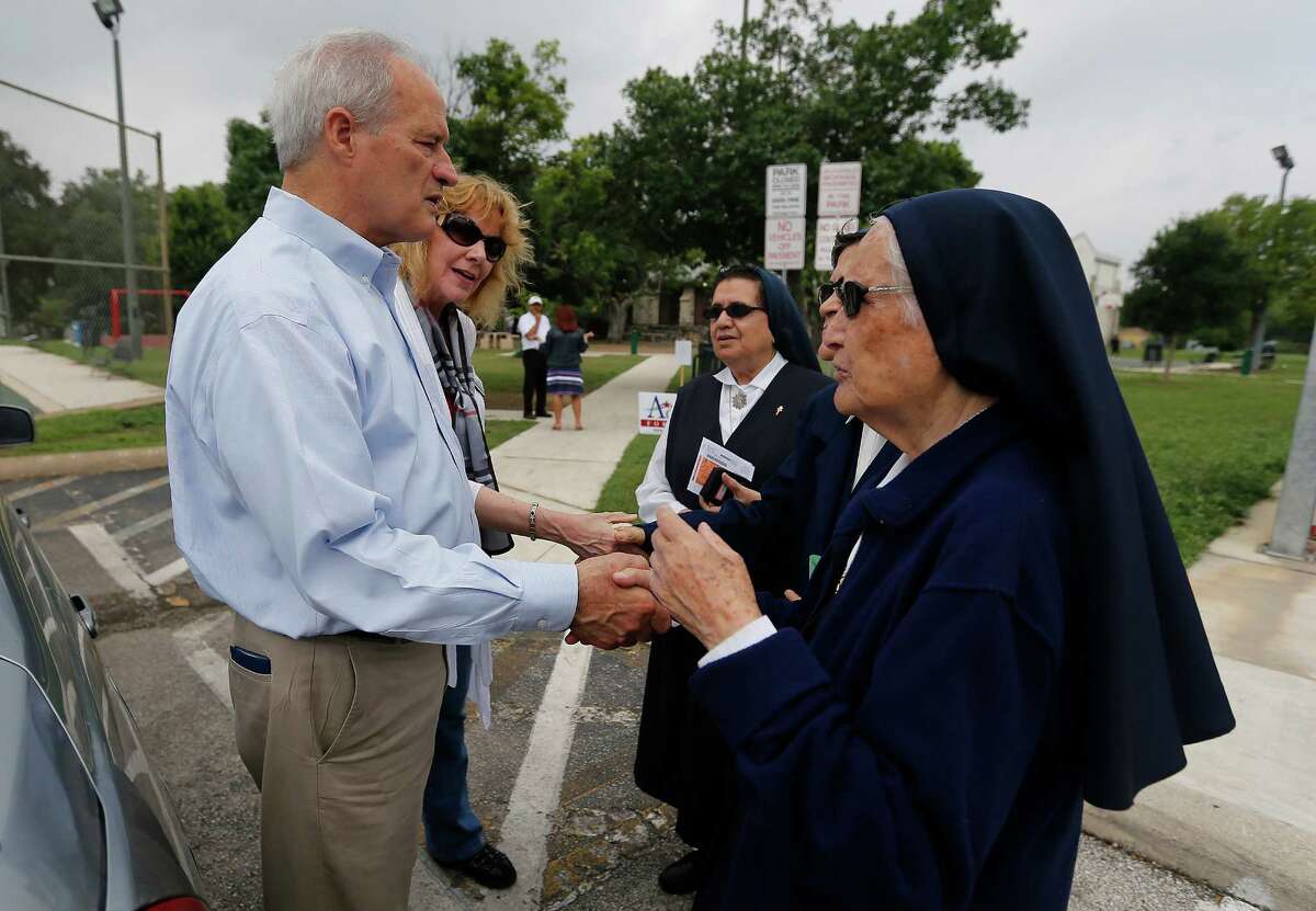 Mayoral candidate Tommy Adkisson (left) and his wife, Karen, chat with nuns from Lady of Perpetual Help at a polling site at James Bode Recreation Center on Saturday, May 9, 2015.