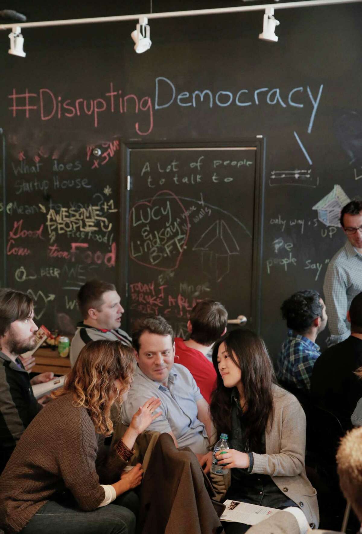 Beth Bounds, Francis Djabri and Jennifer Julian talks while waiting for Presidential candidate Senator Rand Paul, (R-KY) to participate in the "Disrupting Democracy" speaker series at the Startuphouse which was hosted by Lincoln Labs and Brigade in San Francisco, Calif., on Sat. May 9, 2015.