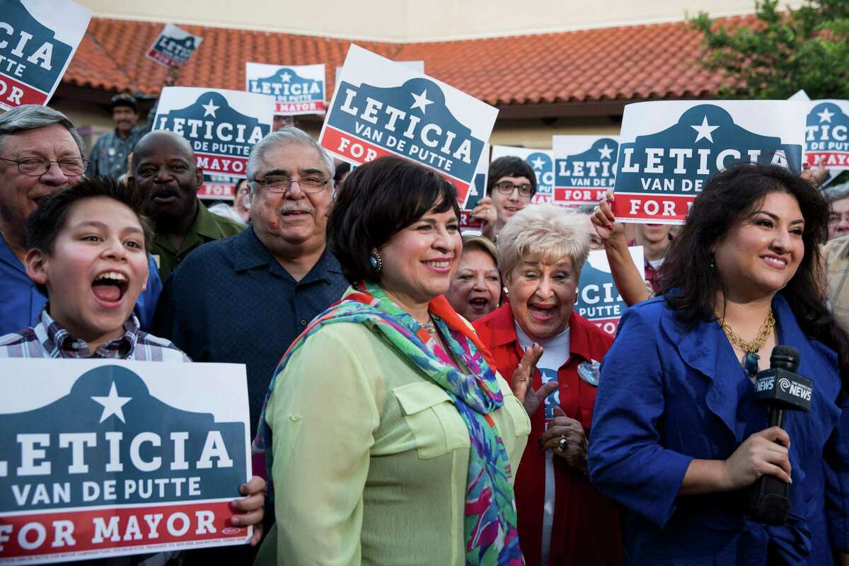 Mayoral candidate Leticia Van de Putte does a television interview surrounded by her family at her campaign headquarters in San Antonio, Texas on Saturday, May 9, 2015.