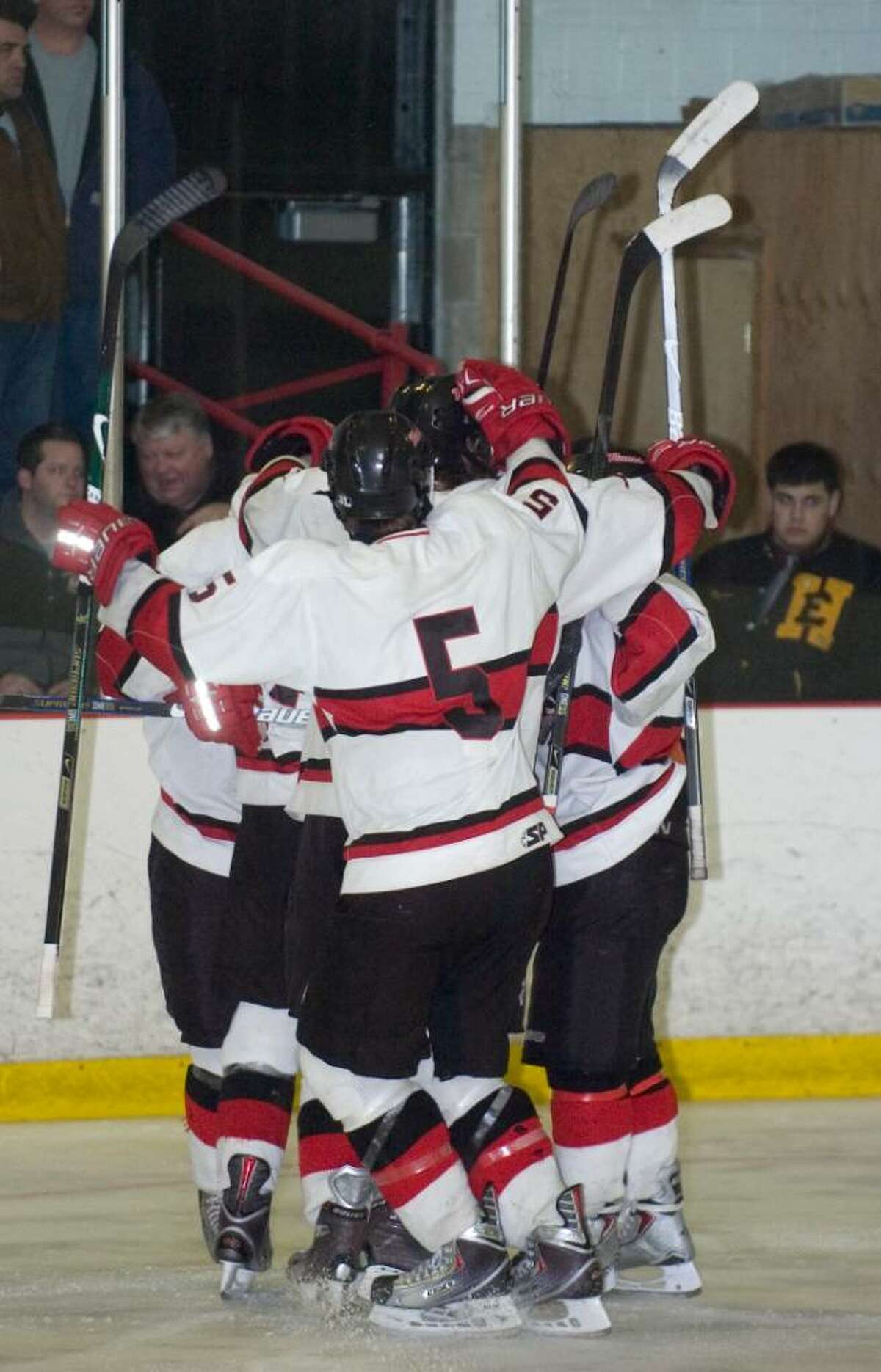 New Canaan celebrates after scoring a goal during the first round of the CIAC Division I ice hockey tournament at the Darien Ice Rink in Darien, Conn. on Wednesday, March 10, 2010.
