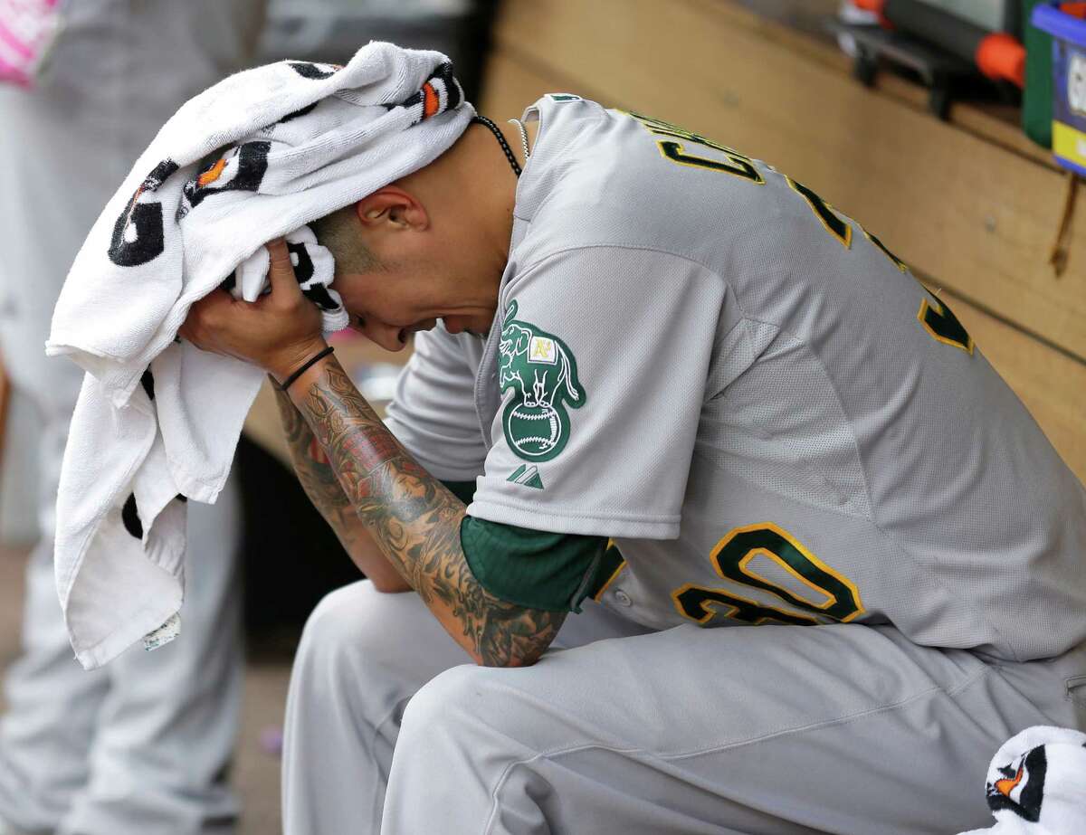 A’s starting pitcher Jesse Chavez Jesse Chavez buries his head in a towel after being pulled from the game in the seventh.