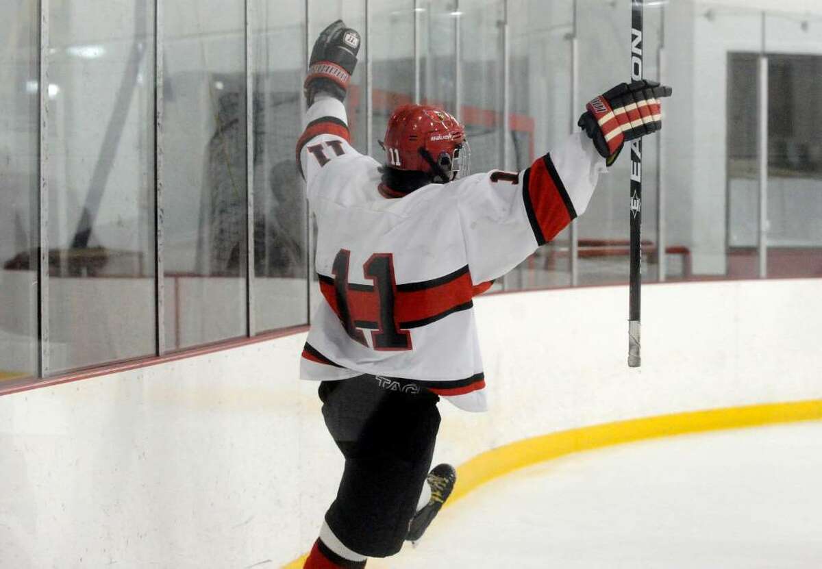Greenwich's Joey Lodato reacts to his unassisted goal as Greenwich High School hosts Ridgefield High in a boys hockey game during the first round of the Division I Boys Hockey Playoffs.