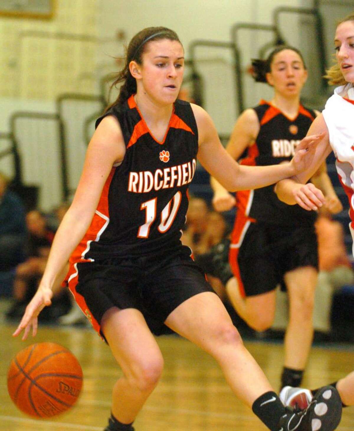Ridgefield's 10, Kathryn Cholko heads up-court during the basketball game against Norwich Free Academy at Southington Wednesday, March 10, 2010.