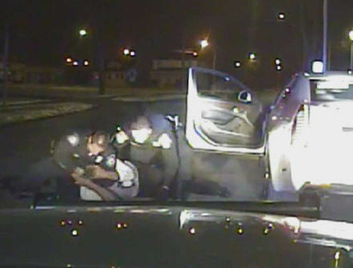 FILE - In this Jan. 28, 2015, file frame grab from a dashcam video provided by the Inkster Police Department, an officer punches Floyd Dent many times in the head while another officer tries to handcuff Dent, who is on the ground in Inkster, Mich. A prosecutor filed charges Monday, April 20, 2015, against the police officer who pulled Dent from his car during the traffic stop and beat him. (AP Photo/Inkster Police Department via Detroit News, File)