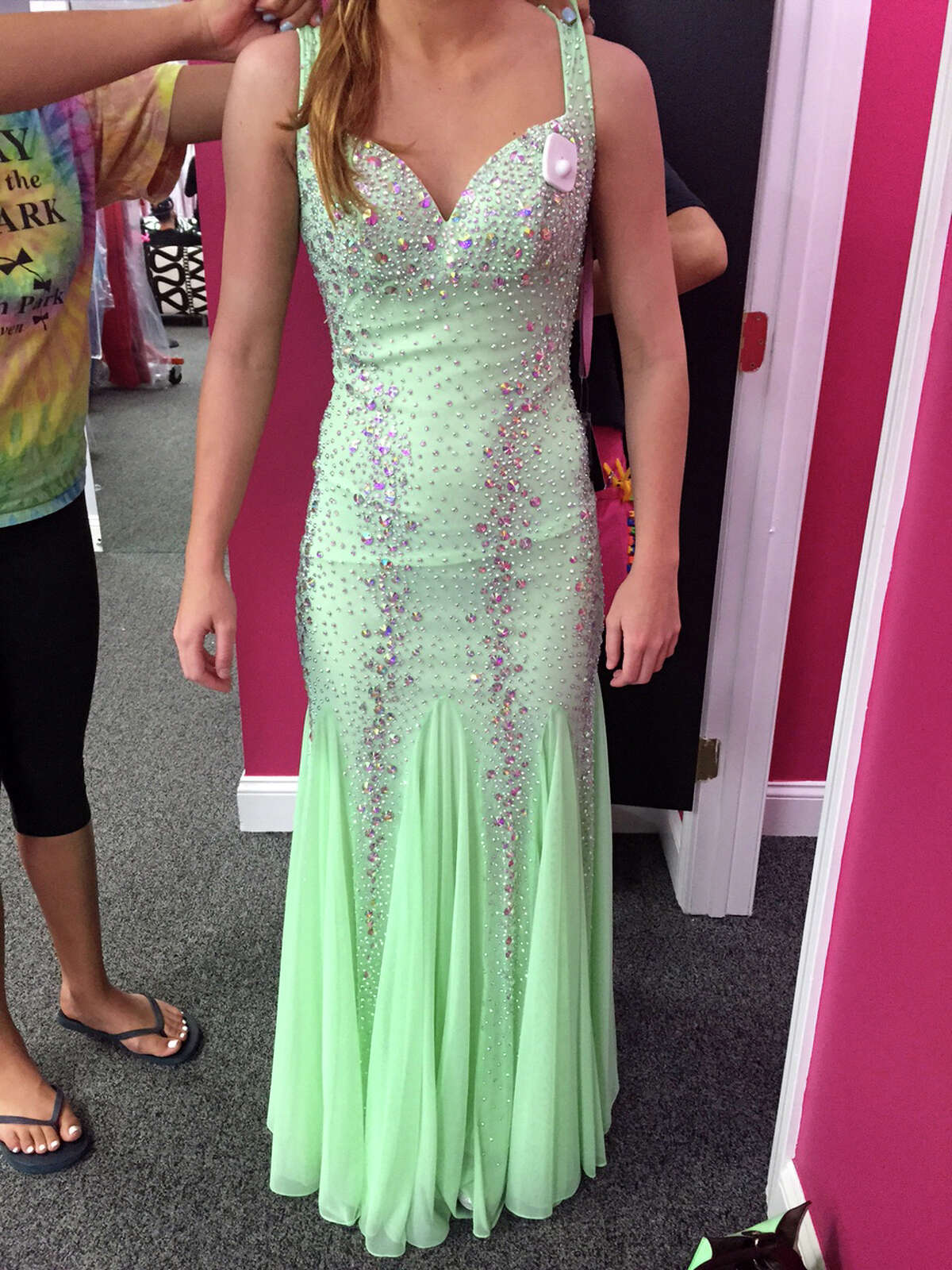 Kylee Opper has her prom dress altered to meet the dress code standard set by the Shelton, Conn. school system. Opper's mother, Trisha Marina, assumed this dress which was purchased after the first one was banned in 2015, would pass muster because only the back was exposed, not the front.
