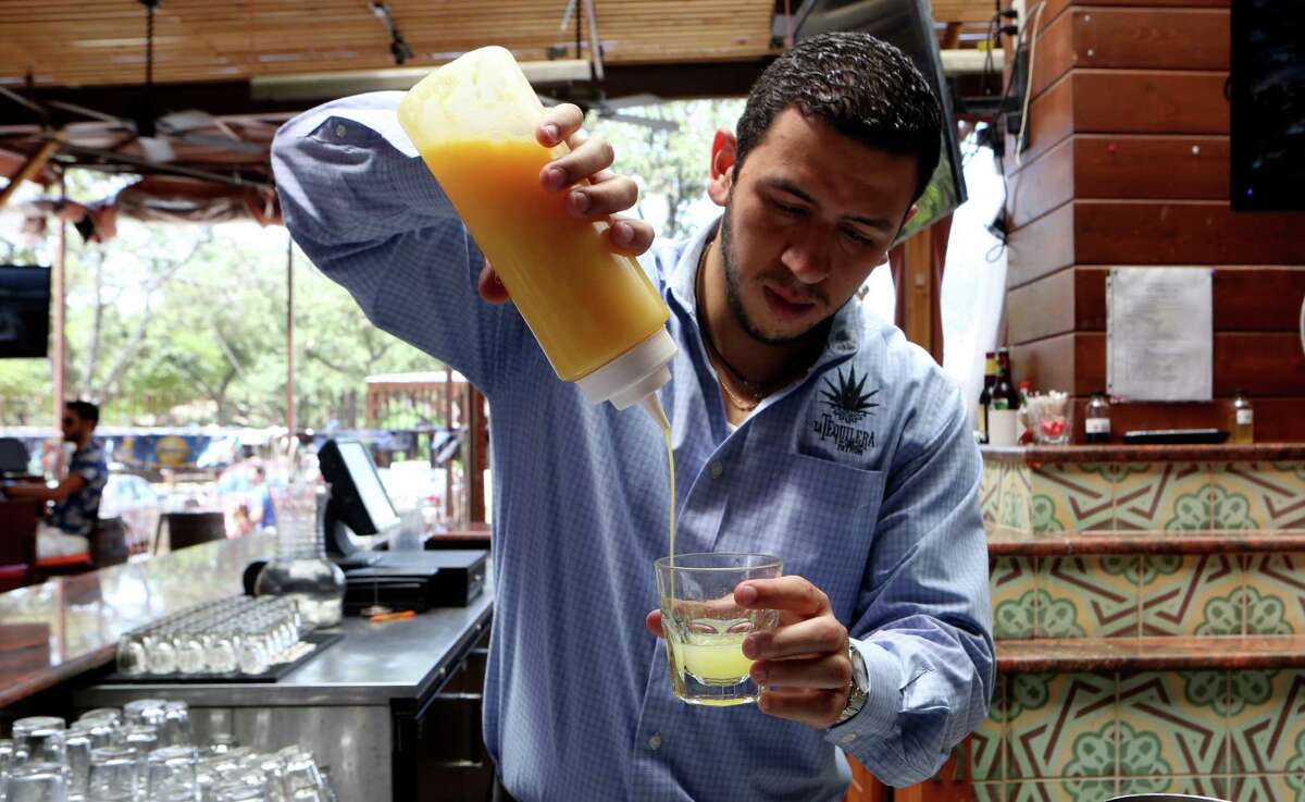 Fernando Echeverri, manager at La Tequilera del Patrón demonstrates how to make a margarita. The margarita at La Tequilera includes lime juice, orange juice, agave nectar, tequila, and orange liqueur.