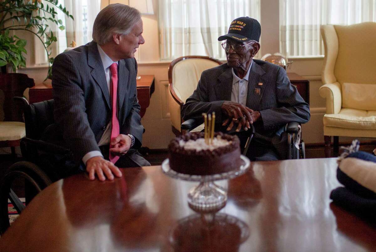 Governor Greg Abbott (left) welcomes Richard Overton (center) and Erline Love in the Conservatory Room of the Governor's Mansion Monday, May 11th, 2015. Governor Greg Abbott and First Lady Cecilia Abbott celebrated Richard Overtonâ€™s 109th birthday at the Texas Governorâ€™s Mansion on Monday, May 11th, 2015.Overton is the oldest living combat veteran from WWII. (Katie Hayes Luke for the San Antonio Express-News)