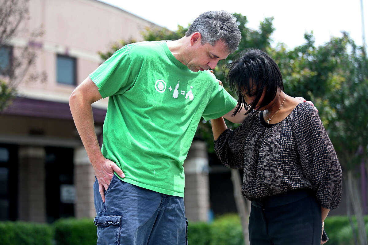 Roger Poupart, Senior Pastor at Wayside Chapel, prays with Mayor Ivy Taylor after he voted at Huebner Elementary School. Taylor greeted voters upon their arrival at the school to vote as she campaigned to keep her position as mayor on election day in San Antonio on Saturday, May 9, 2015.