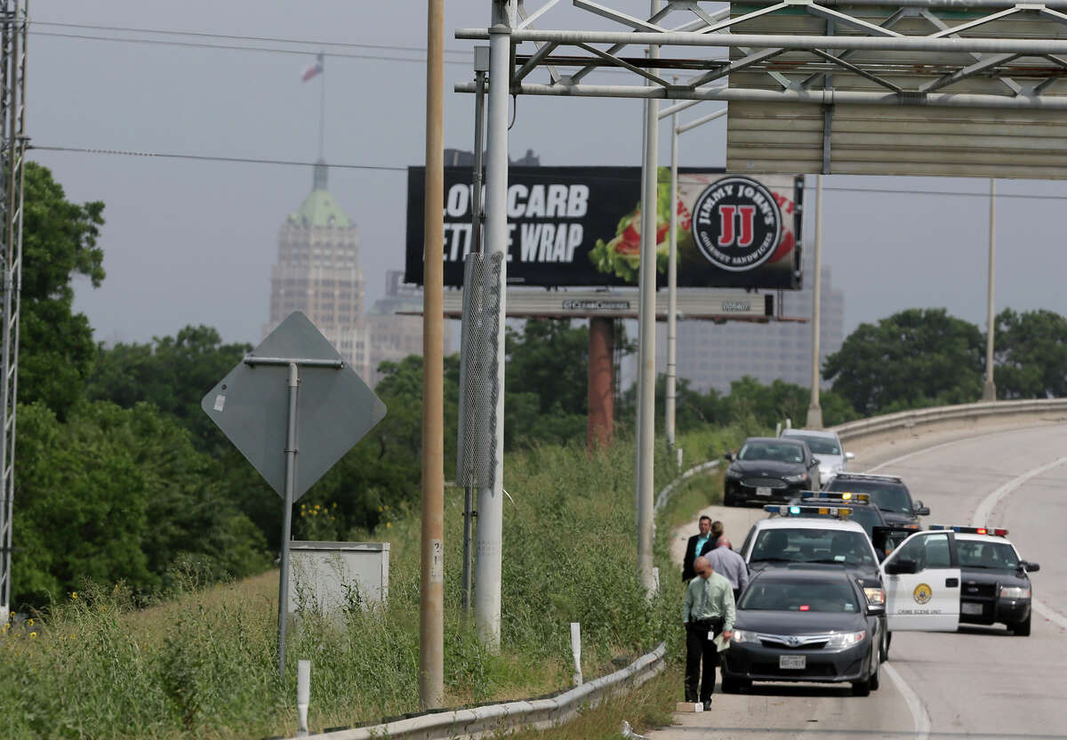 San Antonio police investigate a scene on the side of IH-37 near IH-10 where a deceased small baby was found inside of a piece of luggage about 10:30 a.m. Monday May 11, 2015. Police spokesman Javier Salazar said a worker who was about to mow the area did an inspection before mowing and opened the piece of luggage and contacted police.