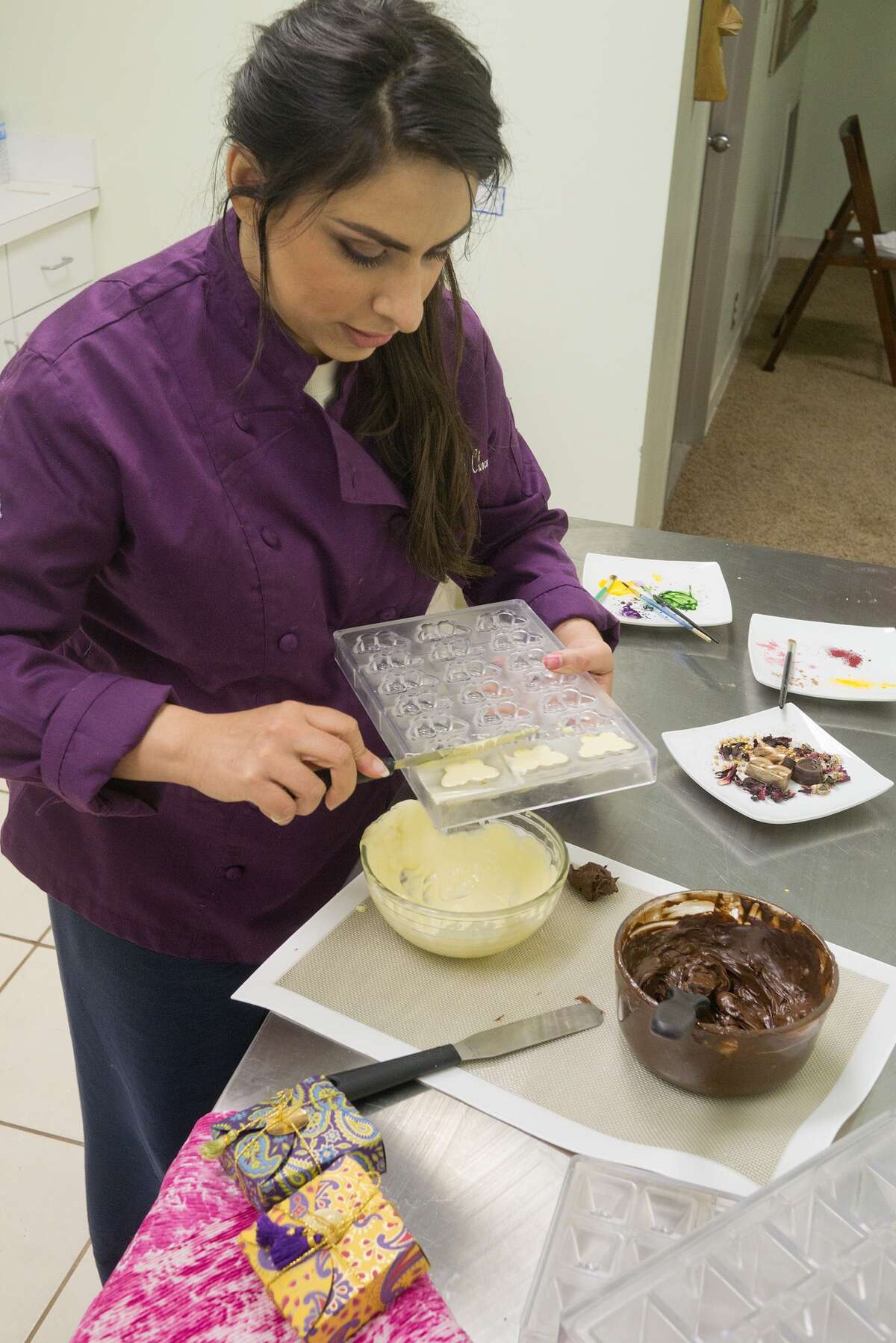 Chocolatier Sarah Ali makes hand-painted chocolates in her kitchen at the Transformation Studio in Sugar Land. Chocolatier Sarah Ali makes hand-painted chocolates in her kitchen at the Transformation Studio in Sugar Land.