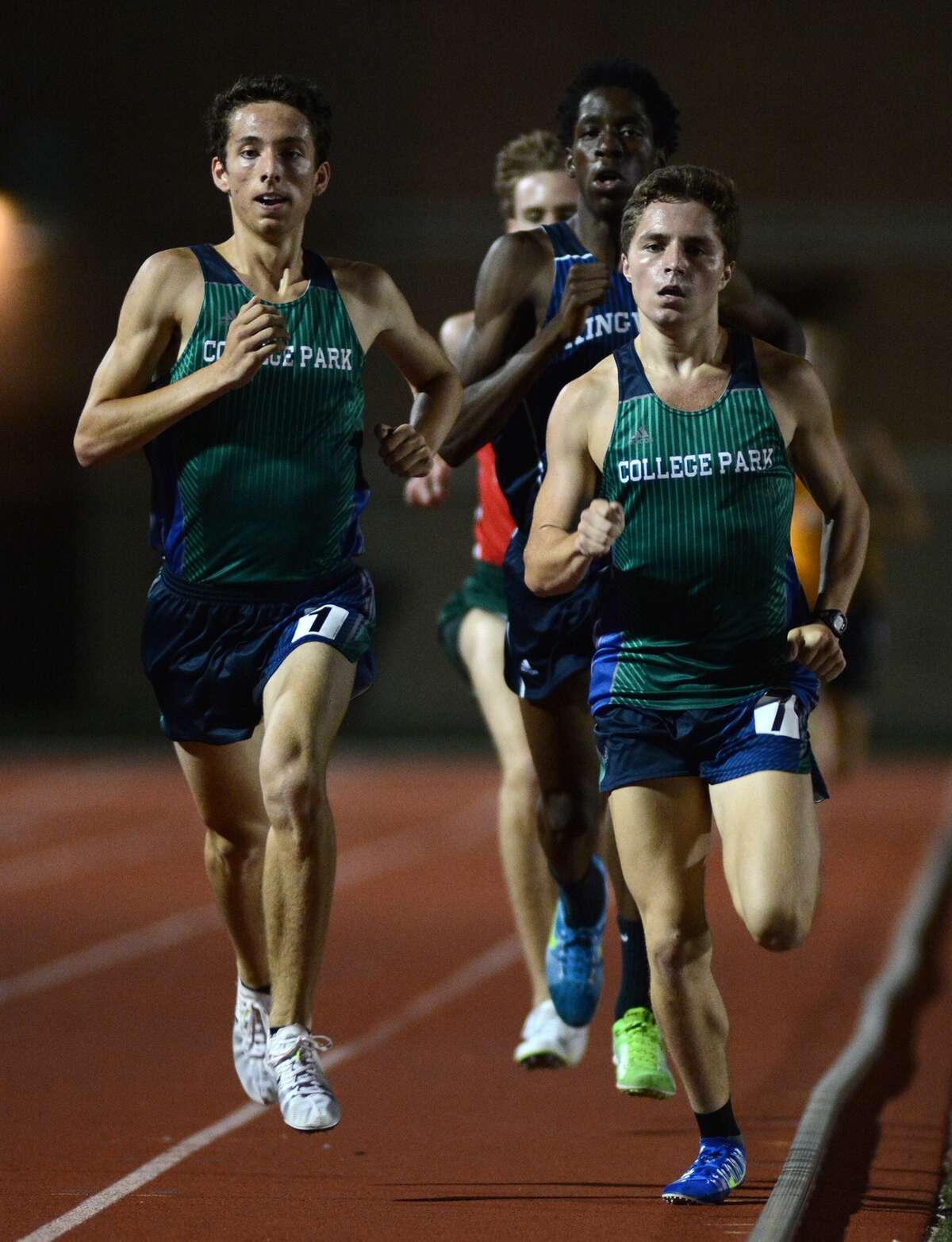 College Park's Connor Meaux, right, and Colton Nettleton lead the pack in the Boys 1600 Meter Run at the District 15/16-6A Area Track Meet at Turner Stadium in Humble on Thursday, April 23, 2015.