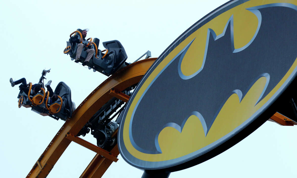 People ride on the new roller coaster at Six Flags Fiesta Texas called Batman: The Ride. It’s a 4-D Wing Coaster that flips riders head-over-heals at least six times.