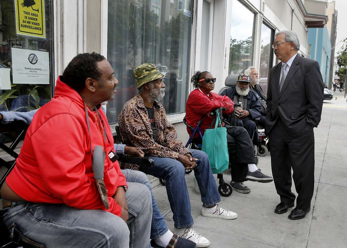 Mayor Ed Lee stopped to talk with residents of the Raman Hotel on Howard Street where he made the announcement Wednesday May 13, 2015. Mayor Ed Lee and members of the Board of Supervisors announced $28.9 million in new funding over the next two years to support the homeless in San Francisco, Calif. including the addition of more than 500 supportive housing units for chronically homeless seniors, expand medical care and continue the new Navigation Center.