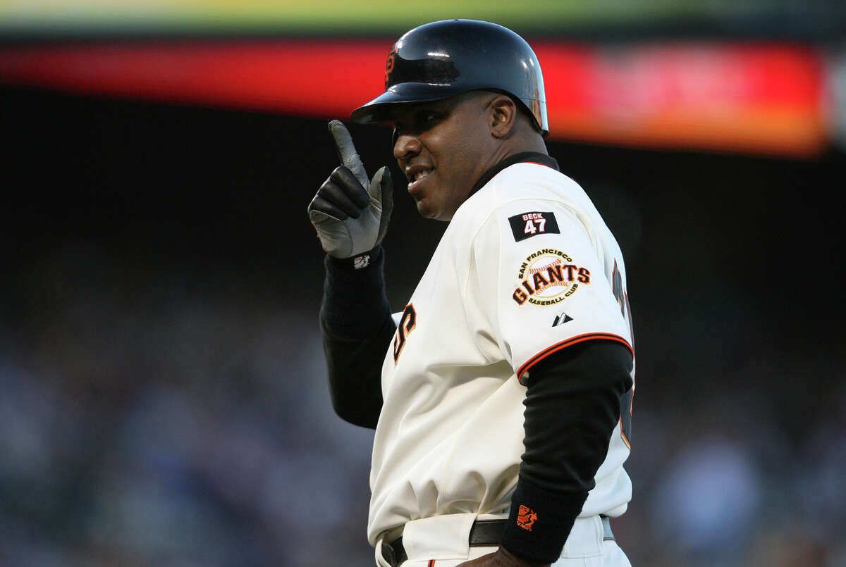 Barry Bonds gestures to someone in the stands after a first-inning walk in August 2007. Bonds hit 28 home runs with a league-high 132 walks in what would be his final season.