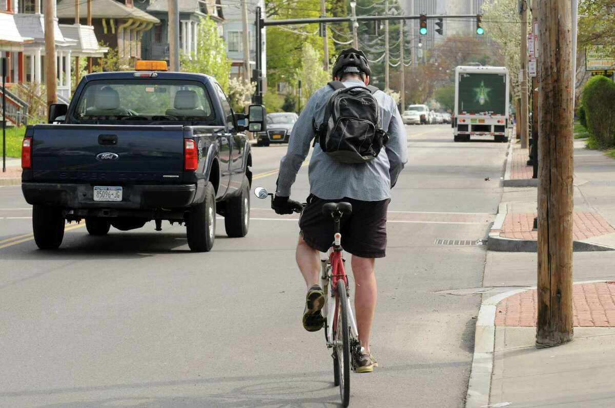 Bill Reynolds of Slingerlands bicycles to work down Delaware Avenue on Thursday May 8, 2014, in Albany, N.Y. (Michael P. Farrell/Times Union archive)