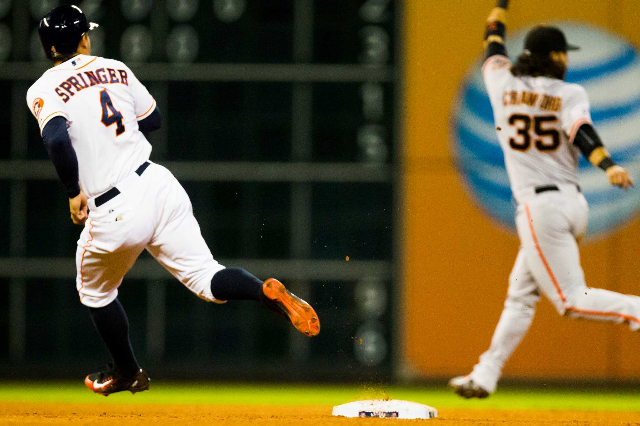 Houston Astros' L.J. Hoes, right, celebrates after his solo home