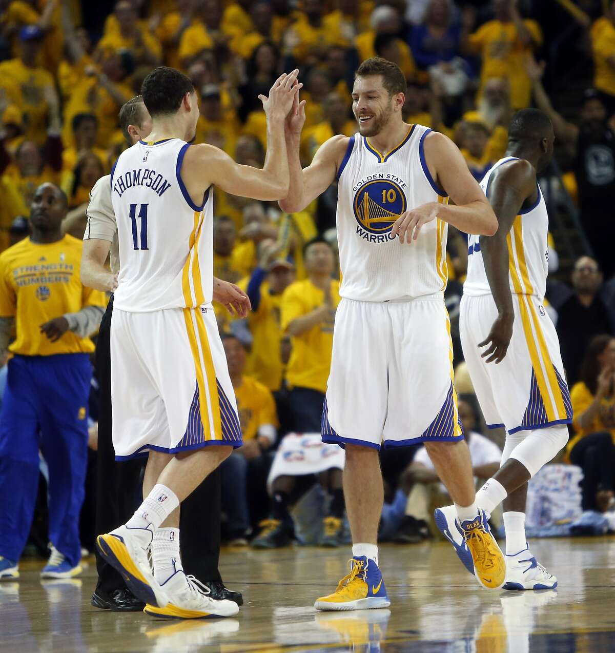 Golden State Warriors' David Lee and Klay Thompson celebrate in 4th quarter during 98-78 win over Memphis Grizzlies during Game 5 of NBA Playoffs' Western Conference Semifinals at Oracle Arena in Oakland, Calif., on Wednesday, May 13, 2015.